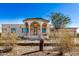 Spanish style home with arched entryway and two-car garage at 27511 N 33Rd Ave, Phoenix, AZ 85083