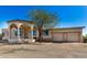 Front view of a home with three car garage at 27511 N 33Rd Ave, Phoenix, AZ 85083