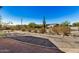 Front yard with desert landscaping and a view of a home beyond at 27511 N 33Rd Ave, Phoenix, AZ 85083