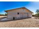 Detached garage with single door and roll-up door, offering extra storage at 27511 N 33Rd Ave, Phoenix, AZ 85083