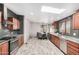 Modern kitchen with stainless steel appliances and wood cabinets at 27511 N 33Rd Ave, Phoenix, AZ 85083