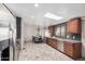 Modern kitchen with stainless steel appliances and wood cabinets at 27511 N 33Rd Ave, Phoenix, AZ 85083