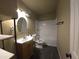 Clean bathroom with a shower/tub combo and dark floor tile at 303 W 13Th St, Eloy, AZ 85131