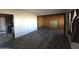 Living room with laminate flooring and built-in shelving at 303 W 13Th St, Eloy, AZ 85131