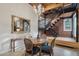 Dining area with a wooden table and exposed brick walls at 304 W Roosevelt St # 102, Phoenix, AZ 85003