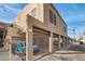 Building exterior with private garages and gated entry at 304 W Roosevelt St # 102, Phoenix, AZ 85003