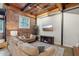 Living room with exposed brick and wooden beams at 304 W Roosevelt St # 102, Phoenix, AZ 85003