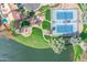 Aerial view showing tennis courts, playground, and lake at 3180 S Greythorne Way, Chandler, AZ 85248