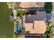 Aerial view of house, pool, and lake access at 3180 S Greythorne Way, Chandler, AZ 85248