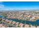 Expansive aerial view of community by lake and golf at 3180 S Greythorne Way, Chandler, AZ 85248