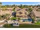 Aerial view of house with pool and lake access at 3180 S Greythorne Way, Chandler, AZ 85248