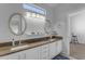 Bathroom with double sinks and granite countertops at 3180 S Greythorne Way, Chandler, AZ 85248