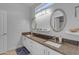 Double vanity bathroom with granite countertop and updated fixtures at 3180 S Greythorne Way, Chandler, AZ 85248