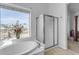 Relaxing bathroom featuring a corner tub and shower at 3180 S Greythorne Way, Chandler, AZ 85248