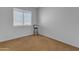 Simple bedroom with neutral carpeting and a window at 3180 S Greythorne Way, Chandler, AZ 85248