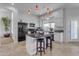 Open kitchen boasting an island, stainless steel appliances, and white cabinets at 3180 S Greythorne Way, Chandler, AZ 85248