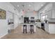 Modern kitchen featuring a center island and updated appliances at 3180 S Greythorne Way, Chandler, AZ 85248