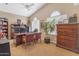 Home office with built-in wooden desk and two chairs at 3180 S Greythorne Way, Chandler, AZ 85248