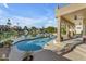 Inviting pool and patio area overlooking the lake at 3180 S Greythorne Way, Chandler, AZ 85248