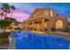 Luxury pool and patio area with sunset view at 3180 S Greythorne Way, Chandler, AZ 85248