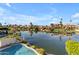 Relaxing pool area overlooking a peaceful canal at 3180 S Greythorne Way, Chandler, AZ 85248