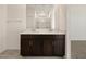 Modern bathroom vanity with double sinks, dark wood cabinets, and contemporary finishes at 3403 E Audrey Dr, San Tan Valley, AZ 85143