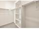 Bright, walk-in closet with shelving and rods for ample storage space at 3403 E Audrey Dr, San Tan Valley, AZ 85143