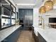 Modern kitchen with marble countertops and farmhouse sink at 3403 E Audrey Dr, San Tan Valley, AZ 85143