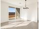 Dining room with tile flooring and sliding glass doors to the backyard at 3403 E Audrey Dr, San Tan Valley, AZ 85143