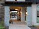 Inviting entryway with stone pillars, overhead lighting, and view of seating area at end of walkway at 3403 E Audrey Dr, San Tan Valley, AZ 85143