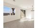 Bright and airy living room with tile floors and large windows at 3403 E Audrey Dr, San Tan Valley, AZ 85143