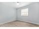 Bright bedroom with light walls and wood-look flooring at 3745 W Carol Ann Way, Phoenix, AZ 85053