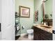 Elegant powder room with granite vanity and decorative accents at 40822 N Harbour Town Way, Anthem, AZ 85086