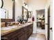 Double vanity bathroom with granite countertop and ample storage at 40822 N Harbour Town Way, Anthem, AZ 85086