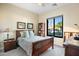 Bright bedroom with wood furniture and window seat at 40822 N Harbour Town Way, Anthem, AZ 85086