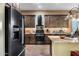 Modern kitchen boasting stainless steel appliances and granite counters at 40822 N Harbour Town Way, Anthem, AZ 85086