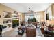 Relaxing living room with built-in shelving and large TV at 40822 N Harbour Town Way, Anthem, AZ 85086