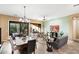 Open living and dining area with large windows and neutral color palette at 40822 N Harbour Town Way, Anthem, AZ 85086