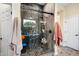 Large walk-in shower with pebble floor and glass enclosure at 40822 N Harbour Town Way, Anthem, AZ 85086