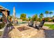 Inviting backyard with a firepit, pool, and comfortable seating at 4142 E Ravenswood Dr, Gilbert, AZ 85298