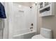 Clean bathroom with a shower/tub combo and a white tile surround at 4142 E Ravenswood Dr, Gilbert, AZ 85298