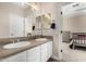 Double vanity bathroom with tiled counters and a view of the bedroom at 4142 E Ravenswood Dr, Gilbert, AZ 85298