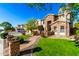 Two-story house with stone accents and a landscaped front yard with a walkway at 4142 E Ravenswood Dr, Gilbert, AZ 85298