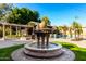 Ornate stone fountain as a centerpiece in the backyard at 4142 E Ravenswood Dr, Gilbert, AZ 85298