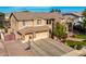 Two-story house with stone accents and three-car garage at 4142 E Ravenswood Dr, Gilbert, AZ 85298