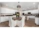 Modern kitchen with white cabinets and granite countertops at 4142 E Ravenswood Dr, Gilbert, AZ 85298