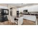 Modern kitchen featuring white cabinets, granite island, and stainless steel appliances at 4142 E Ravenswood Dr, Gilbert, AZ 85298