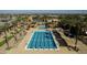 Community lap pool with surrounding lounge chairs and shade structures at 4142 E Ravenswood Dr, Gilbert, AZ 85298