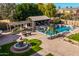 Resort-style pool area with a pergola and fountain at 4142 E Ravenswood Dr, Gilbert, AZ 85298