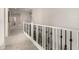 Upstairs hallway with carpeted floor and elegant railing at 4142 E Ravenswood Dr, Gilbert, AZ 85298